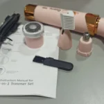 Depiladora recargable mujer 4 en 1 rosa, con accesorios y manual de instrucciones.