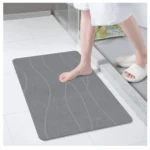 Tapete de piedra diatomeas gris absorbente, con diseño de ondas, ideal para baño.
