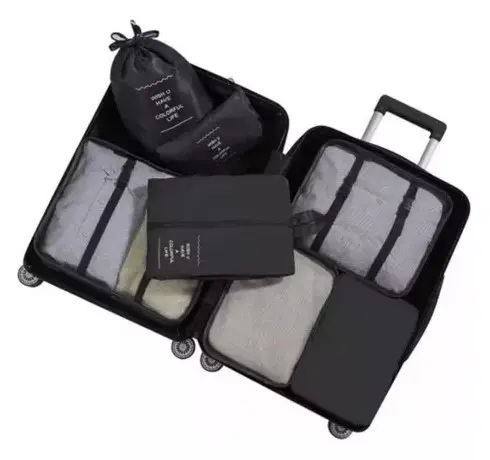Set de 14 bolsas viajeras negras organizadoras para maleta, con compartimentos.