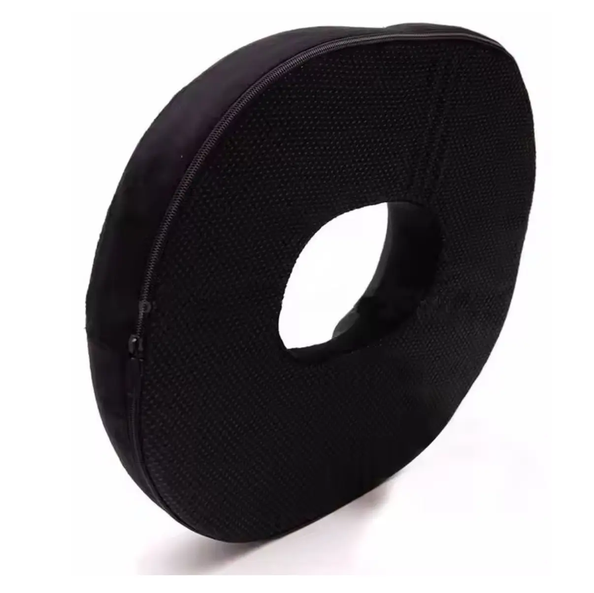 Cojín de espuma viscoelástica en forma de dona color negro con gel para aliviar el coxis.
