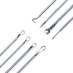 Extractor de espinillas y puntos negros metálicos de precisión para cuidado de la piel.