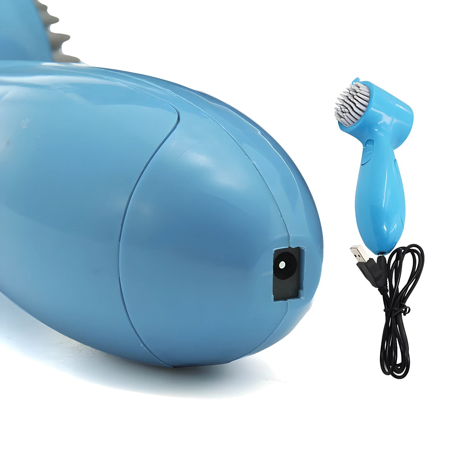 Mini masajeador eléctrico azul tipo tiburón con cargador USB y cepillo.