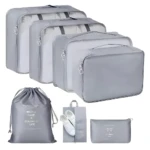 Set 14 bolsas organizadoras para viaje, grises, con compartimento para zapatos y bolso plano.