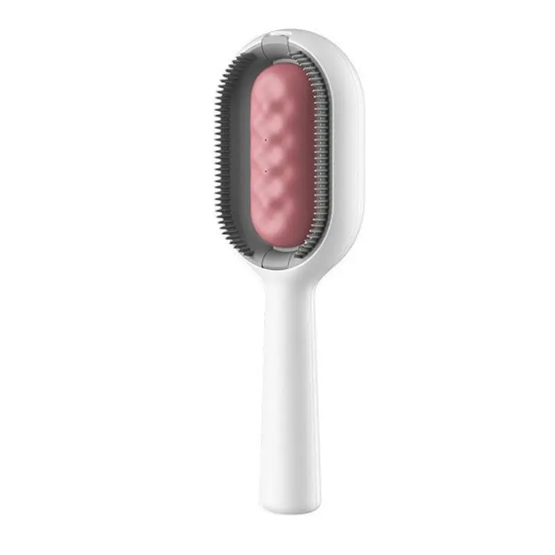 Cepillo masajeador para mascotas blanco y rosa con cerdas para limpieza.