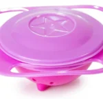 Plato giratorio para bebé de color rosa con tapa morada y diseño de estrella.