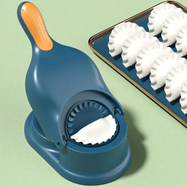 Máquina para dumplings y empanadas, con moldes de masa listos para rellenar.
