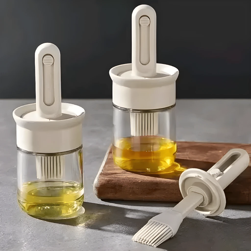 Dispensador de aceite con brocha integrada, ideal para cocina.