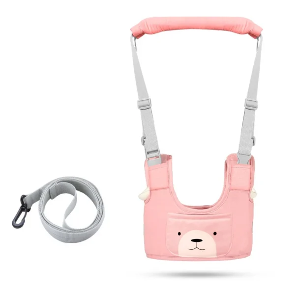 Arnés de aprendizaje para bebé color rosa con diseño de oso y correa ajustable para caminar.