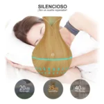 Humidificador difusor de aroma silencioso de madera con persona durmiendo en fondo.