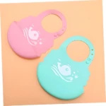 Set x2 baberos de silicona impermeables rosado y verde menta con diseño de ballena.