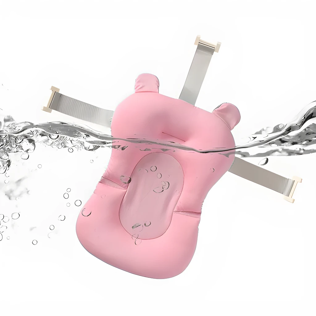 Cojín para bañera de bebé rosado, suave, con correas, flotando en agua con burbujas.