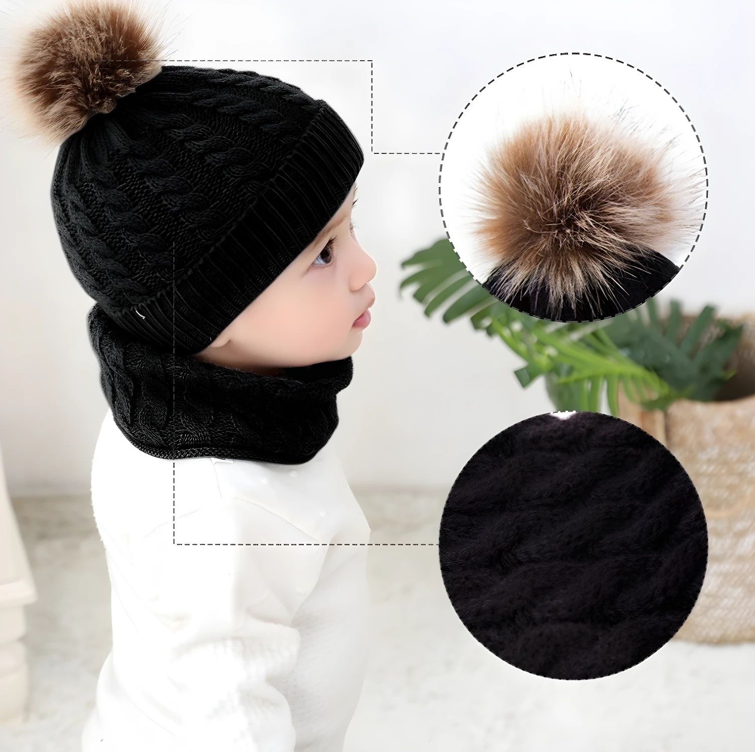 Gorro y bufanda negros tejidos para bebé con pompón de pelo y textura suave.