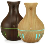 Humidificador difusor de aroma madera oscura y clara con luz led azul y verde.