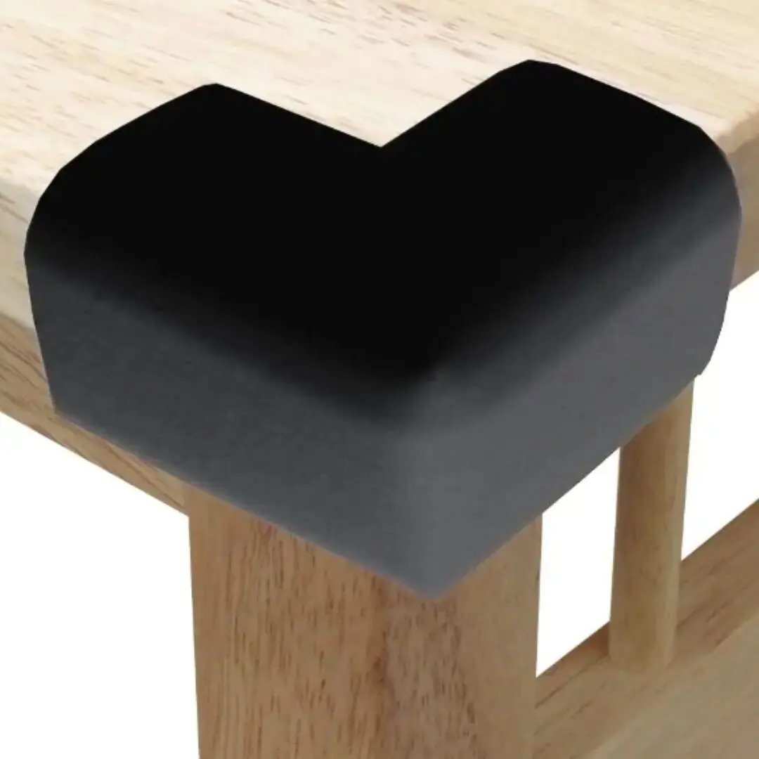 Esquinero protector negro en L para mesa de madera, ideal para seguridad infantil.