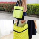 Bolso de mercado portátil amarillo con puntos blancos, ideal para compras, ligero y plegable.