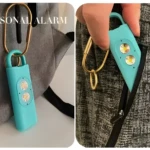 Alarma de seguridad personal turquesa con luces LED y clip para bolso.
