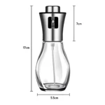 Dispensador atomizador de aceite en spray, botella transparente de vidrio y acero inoxidable, 17cm de alto.