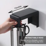 Organizador giratorio negro para colgar utensilios de cocina, con cabeza retráctil.