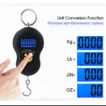 Pesa maletas digital portátil con pantalla LCD mostrando conversiones Kg, Lb, Jin y Oz.