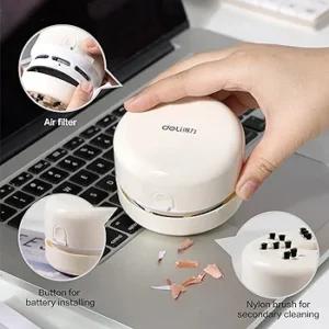 Mini aspiradora portátil Deli eliminando residuos de teclado, ideal para limpieza de escritorio.