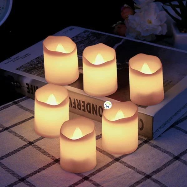 Velas led decorativas pequeñas Ak3008 en grupo sobre libro.