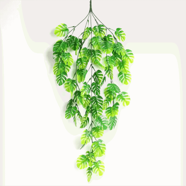 Helecho colgante decorativo artificial para interiores, hojas verdes vibrantes.