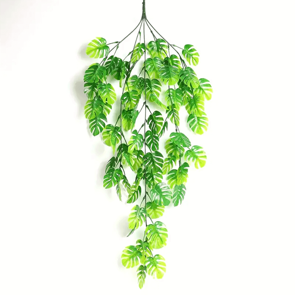 Helecho colgante decorativo artificial para interiores, hojas verdes vibrantes.