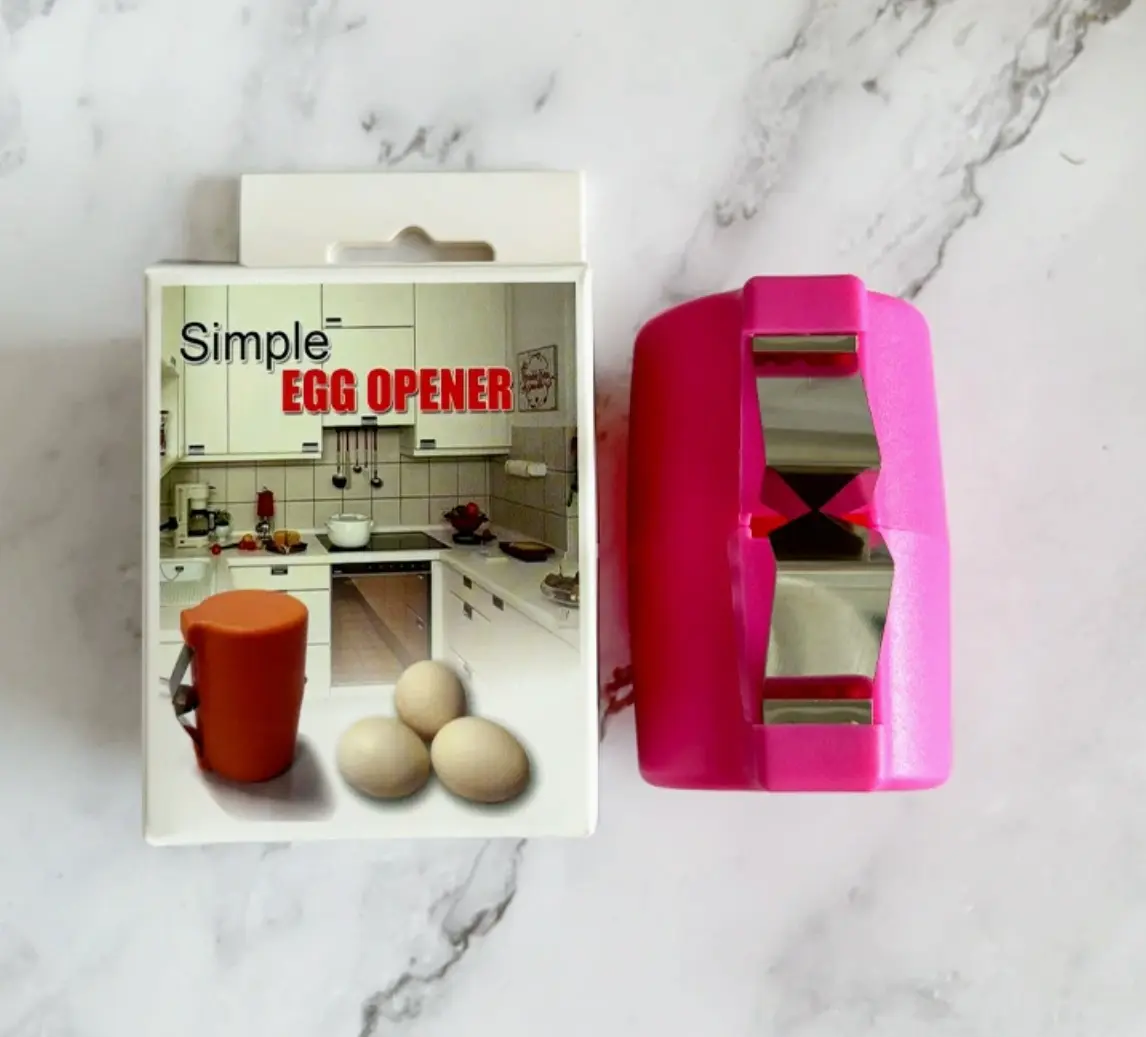 Set x2 abre huevos rosado y empaque de cocina con huevos.
