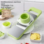 Picatodo multifuncional de acero inoxidable para cortar vegetales, con varios cuchillos intercambiables.