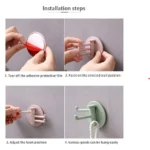 Gancho adhesivo giratorio x3 para colgar objetos fácilmente en la pared.