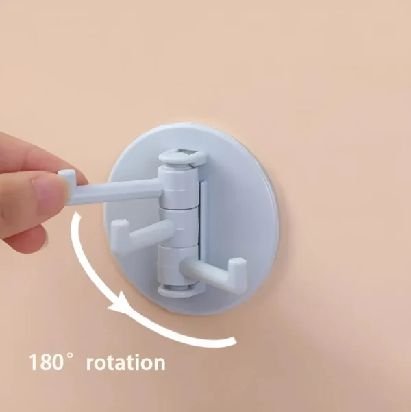 Gancho adhesivo giratorio con 3 brazos, ideal para colgar objetos con rotación de 180°.
