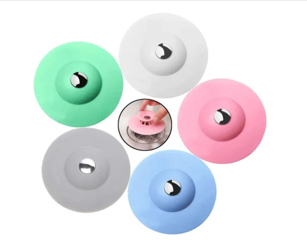 Tapón de silicona para drenaje: verde, blanco, gris, azul y rosa con detalle metálico.
