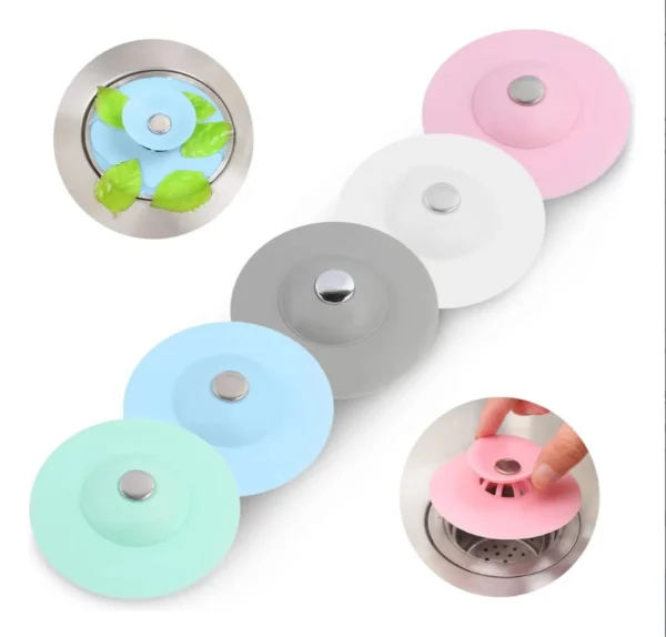 Tapón de silicona para drenaje, varios colores, con fijación central, ideal para evitar obstrucciones.