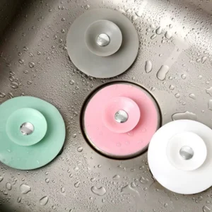 Tapones de drenaje en silicona multifuncional grises, verdes, rosas y blancos para lavaplatos y desagües.