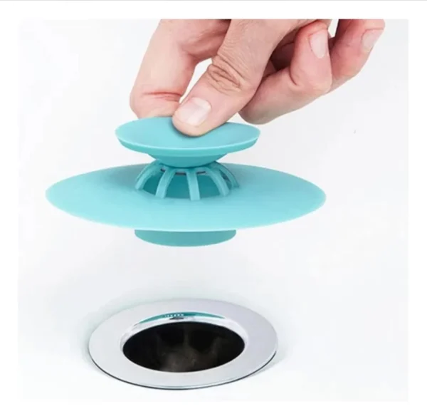 Tapa de silicona para drenaje, atrapa cabello y previene obstrucciones en lavamanos y duchas.