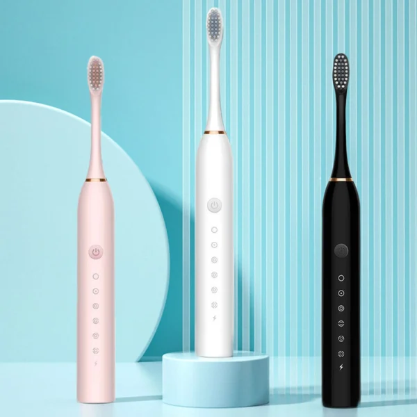 Cepillos dentales eléctricos recargables en rosa, blanco y negro, con cerdas suaves.