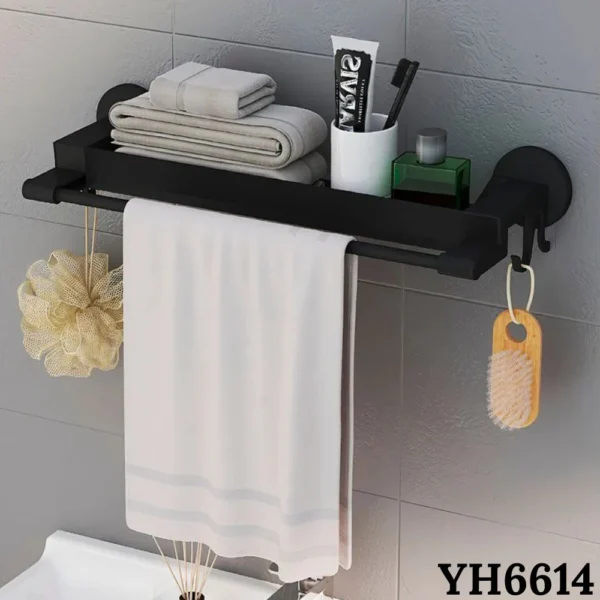 Estante negro para baño con toalla colgada y accesorios, ideal para organizar.