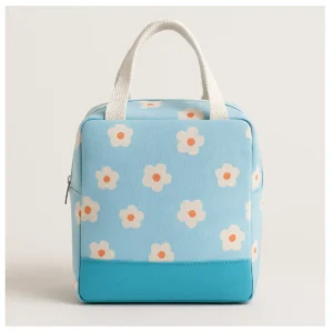 Bolsa lonchera térmica azul con flores blancas y naranjas, ideal para almuerzos.