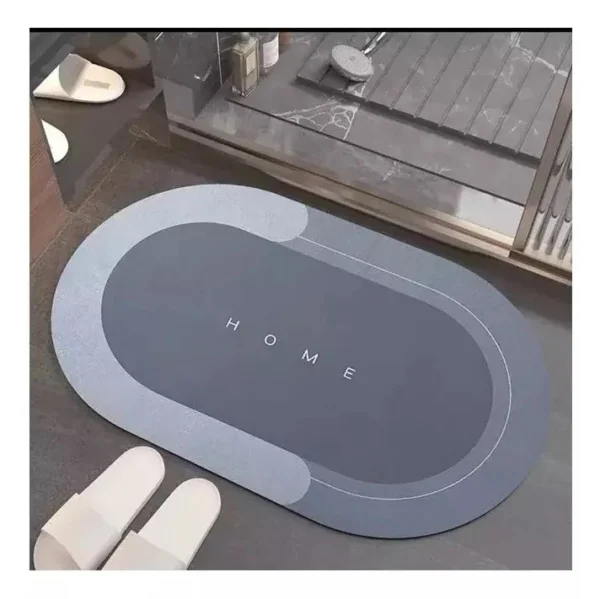 Tapete antideslizante y absorbente con la palabra "HOME" en gris.