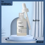 Suero Buffet Ordinary 60ml de ácido hialurónico y péptidos, en frasco de vidrio con gotero, sobre pedestal.