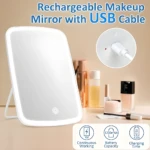 Espejo de maquillaje recargable con luz LED, pantalla táctil y cable USB.