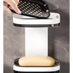 Jabonera doble nivel con repisa y drenaje, ideal para baño moderno.