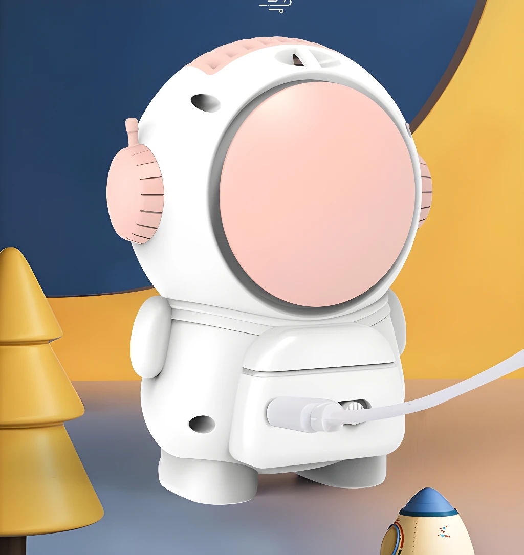 Mini ventilador astronauta portátil, diseño divertido, ideal para escritorio y hogar.