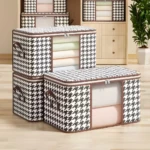 Organizador de sábanas y cobijas con diseño de pata de gallo y ventanas transparentes.