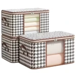 Organizador de sábanas y cobijas apilable con diseño de pata de gallo y ventana transparente.