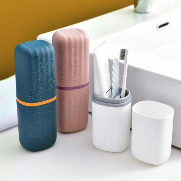 Estuche organizador para cepillo de baño con cepillo y pasta de dientes, color azul y rosado.
