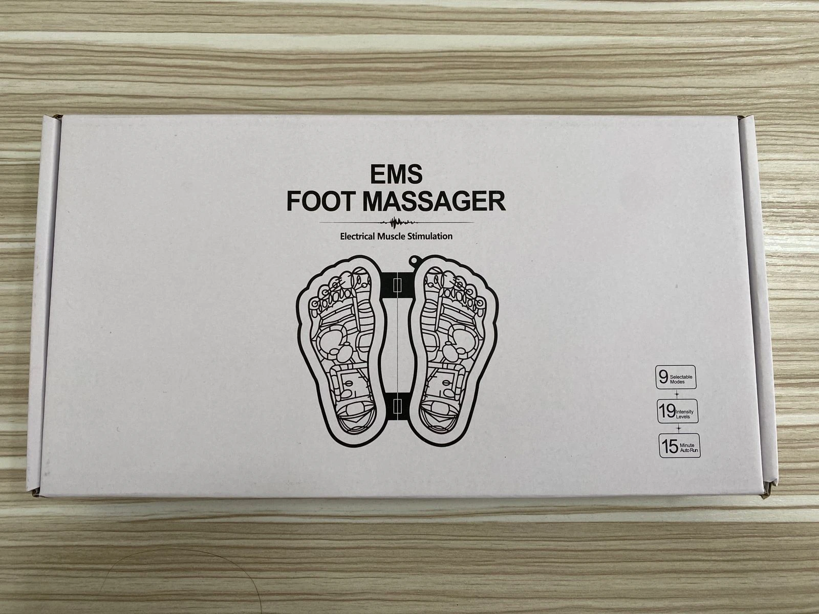 Tapete masajeador de pies EMS con 9 modos, 19 niveles de intensidad y auto-apagado de 15 minutos.