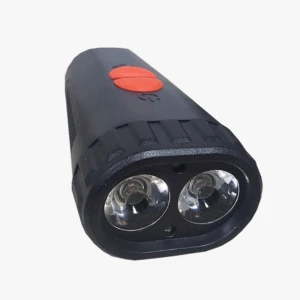 Linterna LED negra para bicicleta con pito y dos luces frontales.