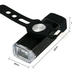 Luz de bicicleta recargable USB, delantera negra, con banda de montaje y medidas 82x28x22mm.