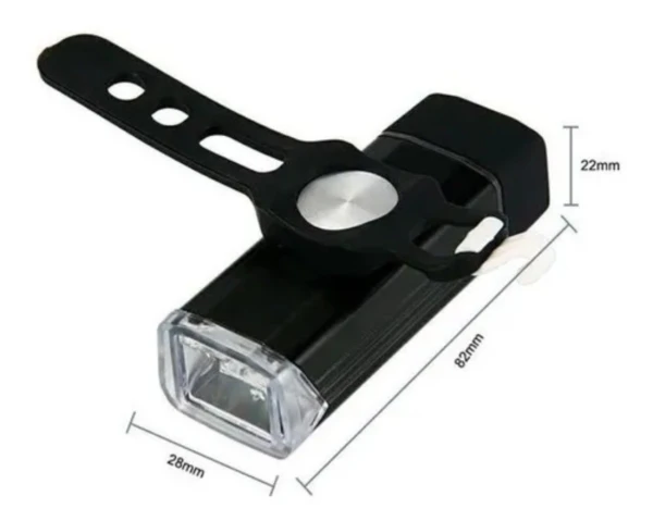 Luz de bicicleta recargable USB, delantera negra, con banda de montaje y medidas 82x28x22mm.